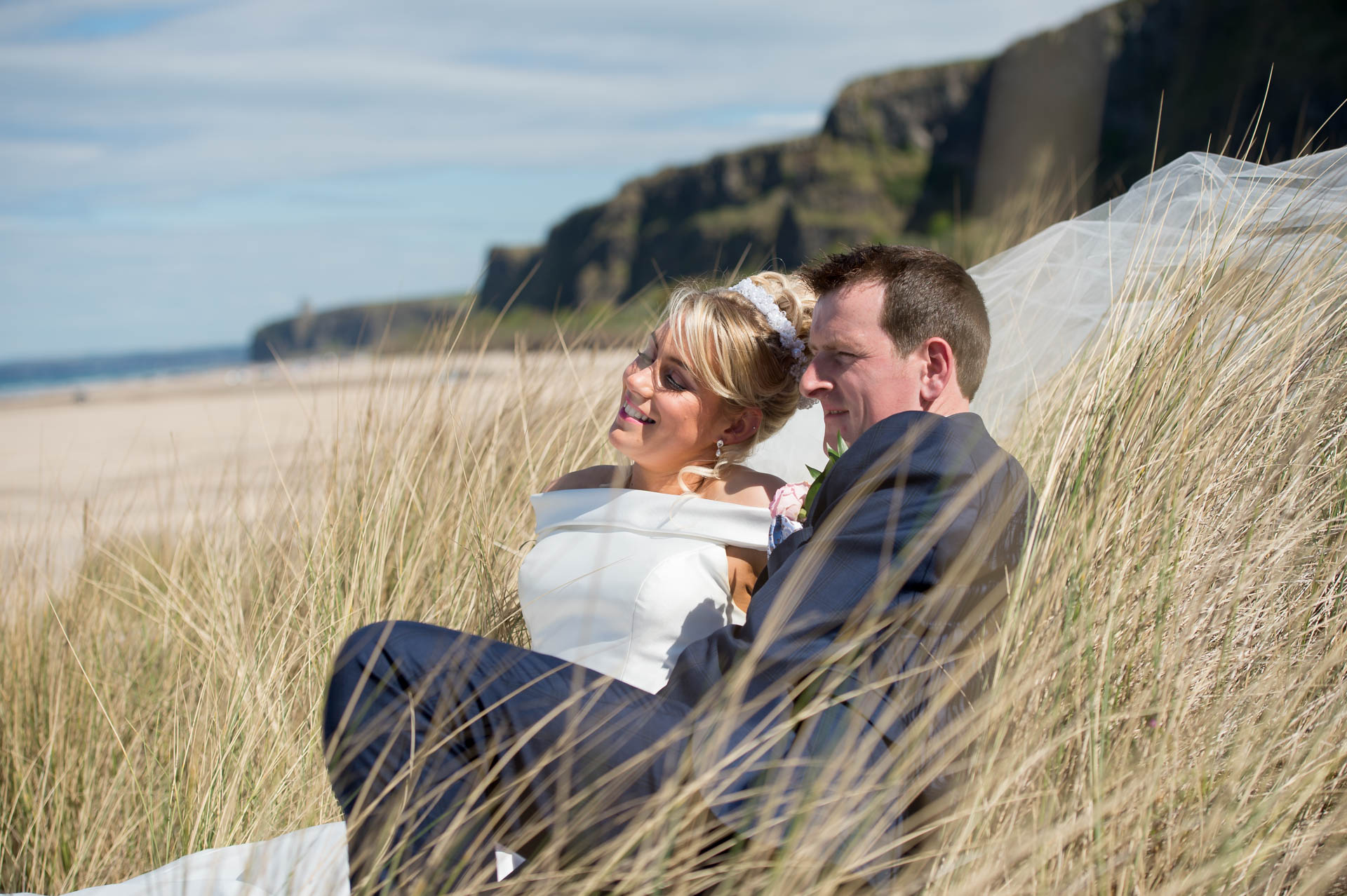 Picture of Noeleen and Cahal at Benone Beach on their wedding day, captured by Fermanagh, Tyrone and Northern Ireland Wedding Photographer, Trevor Lucy Photography